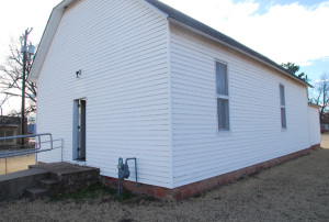 Outside of what is thought to be the building that housed the Fire-Baptized Holiness Church congregation in Lamont, Oklahoma.