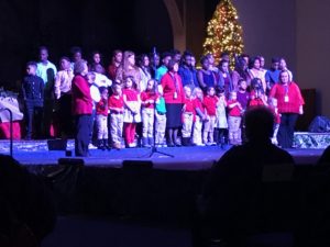 Children standing on stage.