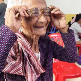 Patient recieves reading glasses at a medical clinic