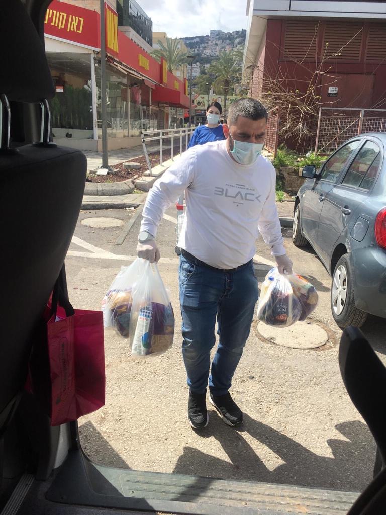 Man delivering groceries to Holocaust survivors