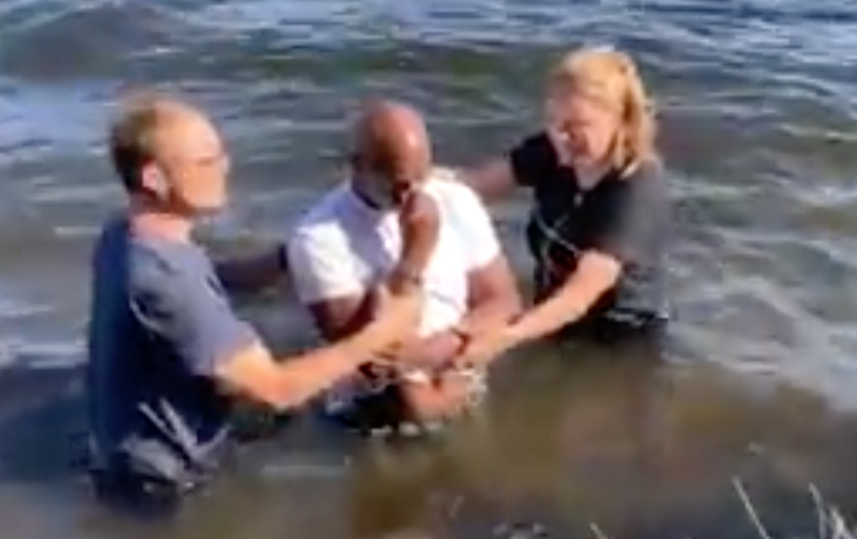 People being baptized