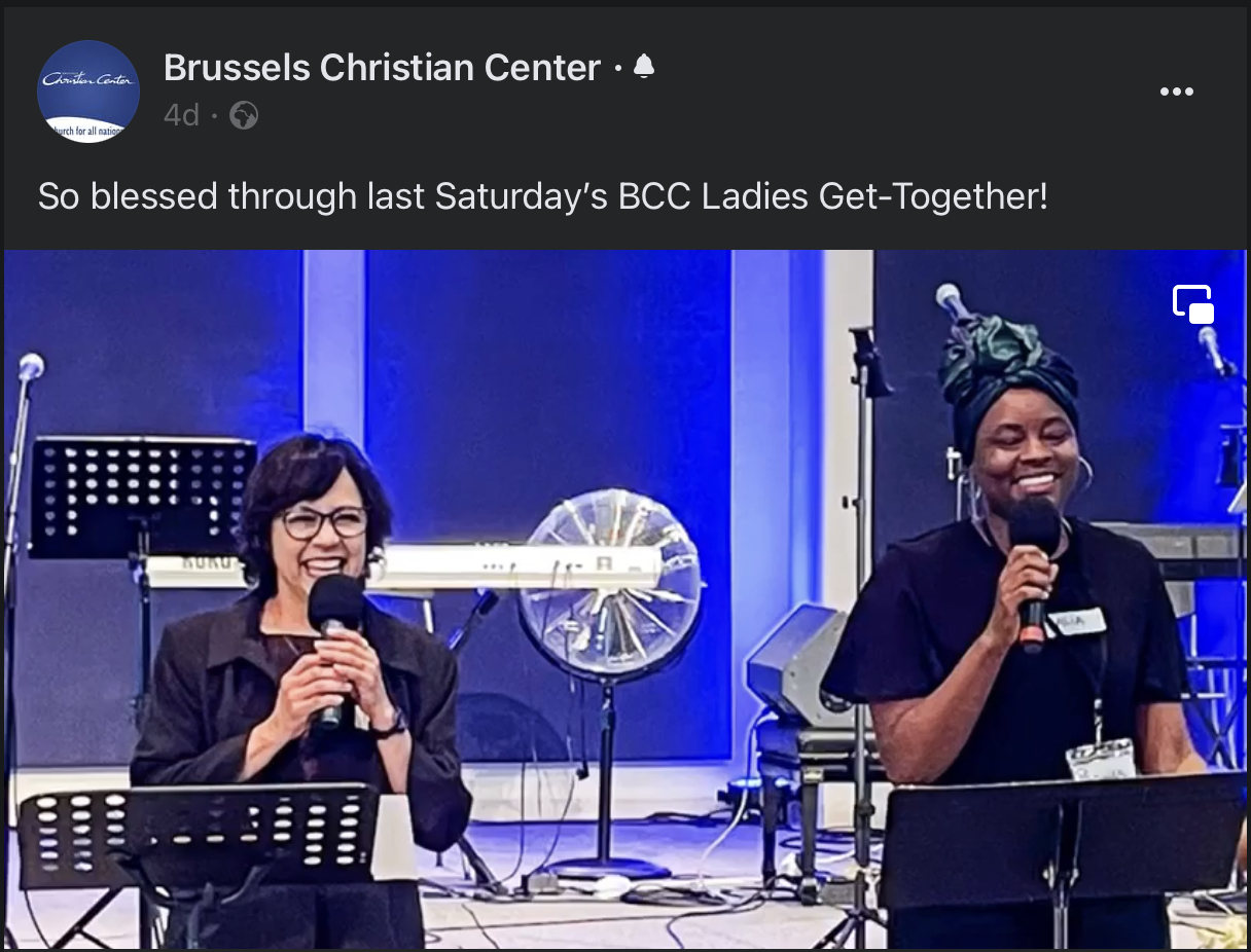 Lulu speaking at a women's conference in Belgium.