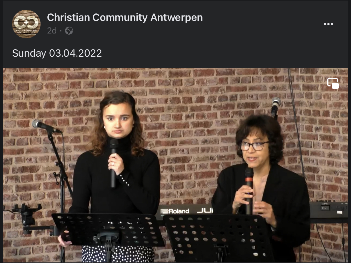 Lulu speaking at the local church in Antwerp.