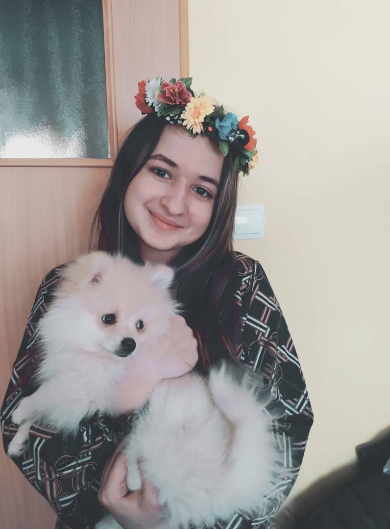 Karina Omelchenko holding her dog