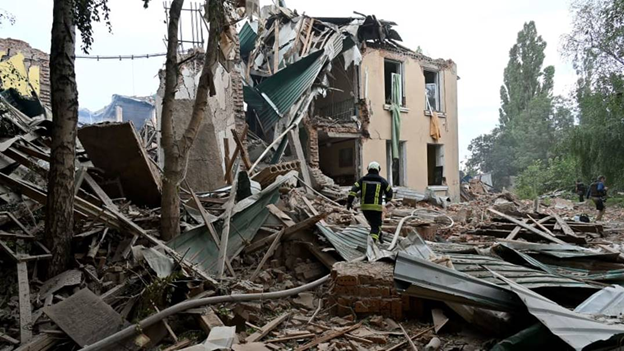 Rescue teams dig through the rubble of buildings destroyed in overnight attacks in a search for survivors, in the city of Chuhuiv, Kharkiv region, on July 25, 2022, amid the Russian invasion of Ukraine. Sergey Bobok | AFP | Getty Images