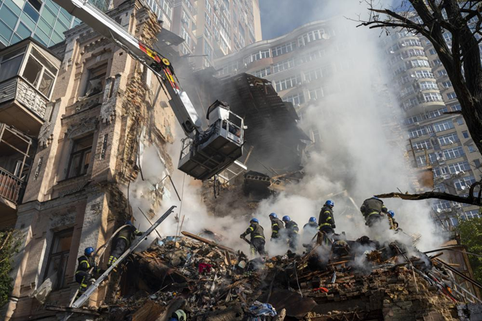 Firefighters work after a drone attack on buildings in Kyiv, Ukraine, on Oct. 17, 2022. Russia has declared its intention to increase its targeting of Ukraine’s power, water and other vital infrastructure in its latest phase of the nearly 8-month-old war. (AP Photo/Roman Hrytsyna, File)