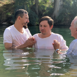 Baptism taking place in the Jordan River