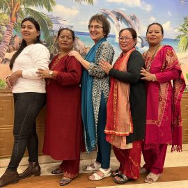 Judith Williams posing with some ladies in India