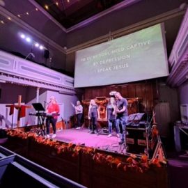 Janene leading worship at Compassion Bridgend