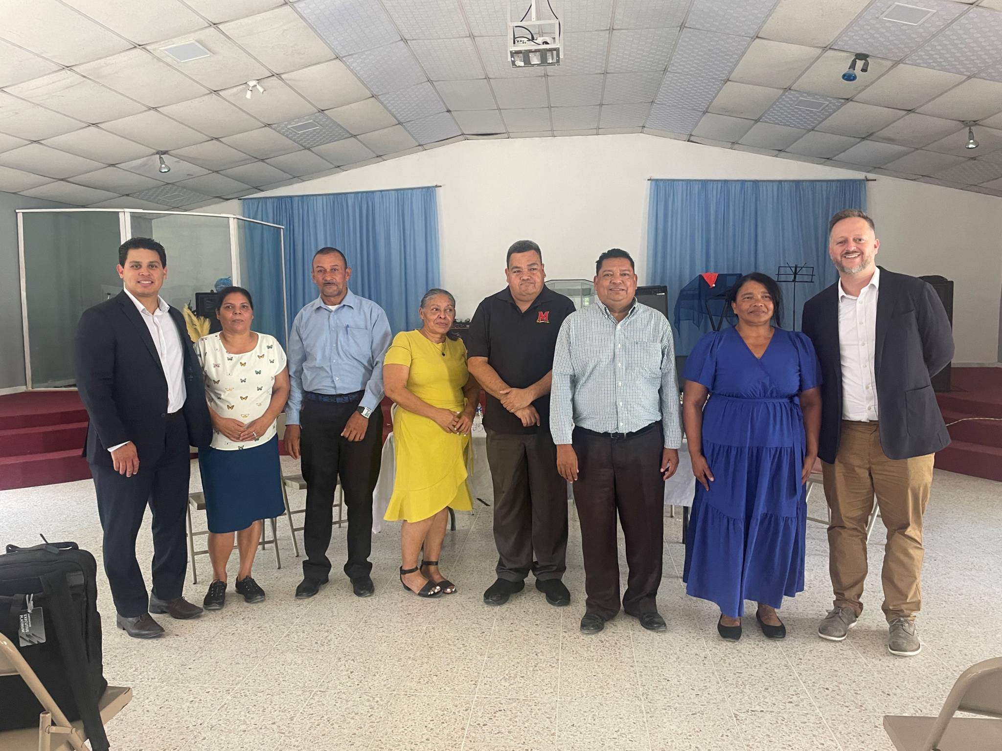 Bishop Sergio Castro and Rev. Bryan Nix alongside Honduras Leadership (pictured from left to right: Bishop Sergio Castro, Doris Aracely Hernandez Flores, Mario Sosa, Maria "Noebly" Nunez Avivo, Rony Alberto Funes Aguilar, Abel Martinez Sormiento, Bishop Maria Cruz, Rev. Bryan Nix.)