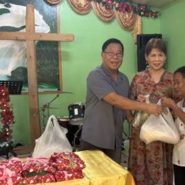 Providing bags of food at Christmas. 