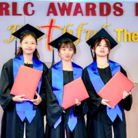 Three Students being recognized after earning their GED