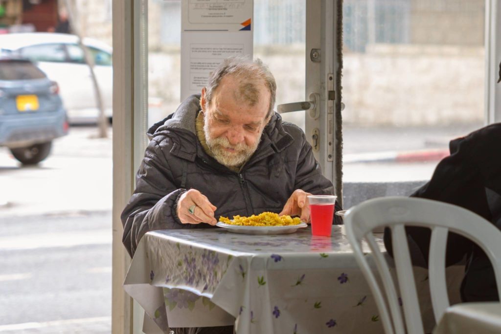 man eating at a table